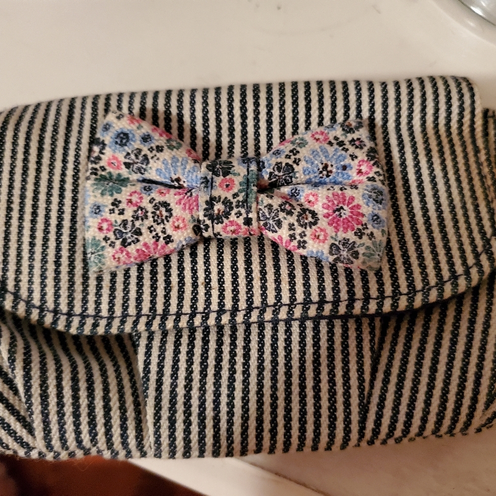 Striped change purse with floral bow
